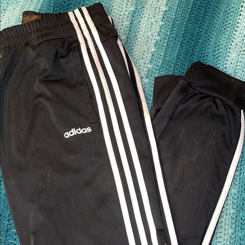 Adidas size L, small tear